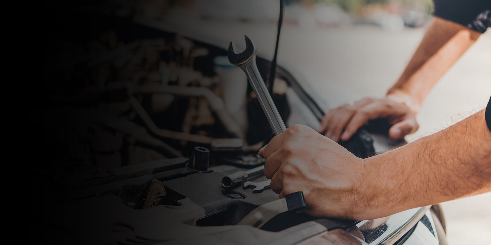 Auto mechanic working in garage 